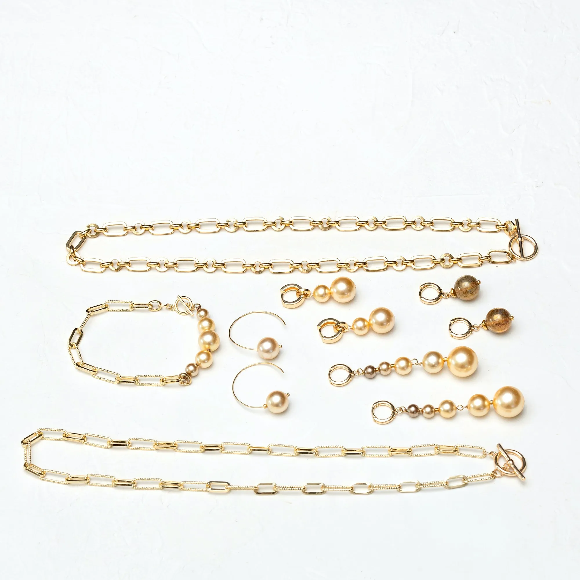 Graded South Sea Huggie Earrings