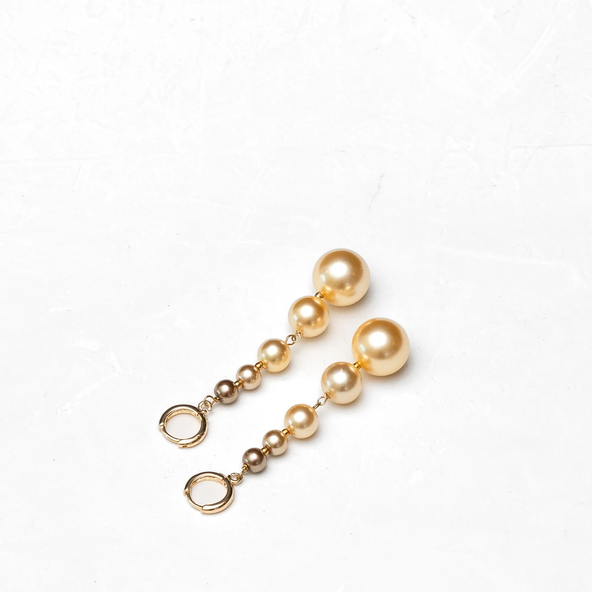 Graded South Sea Huggie Earrings