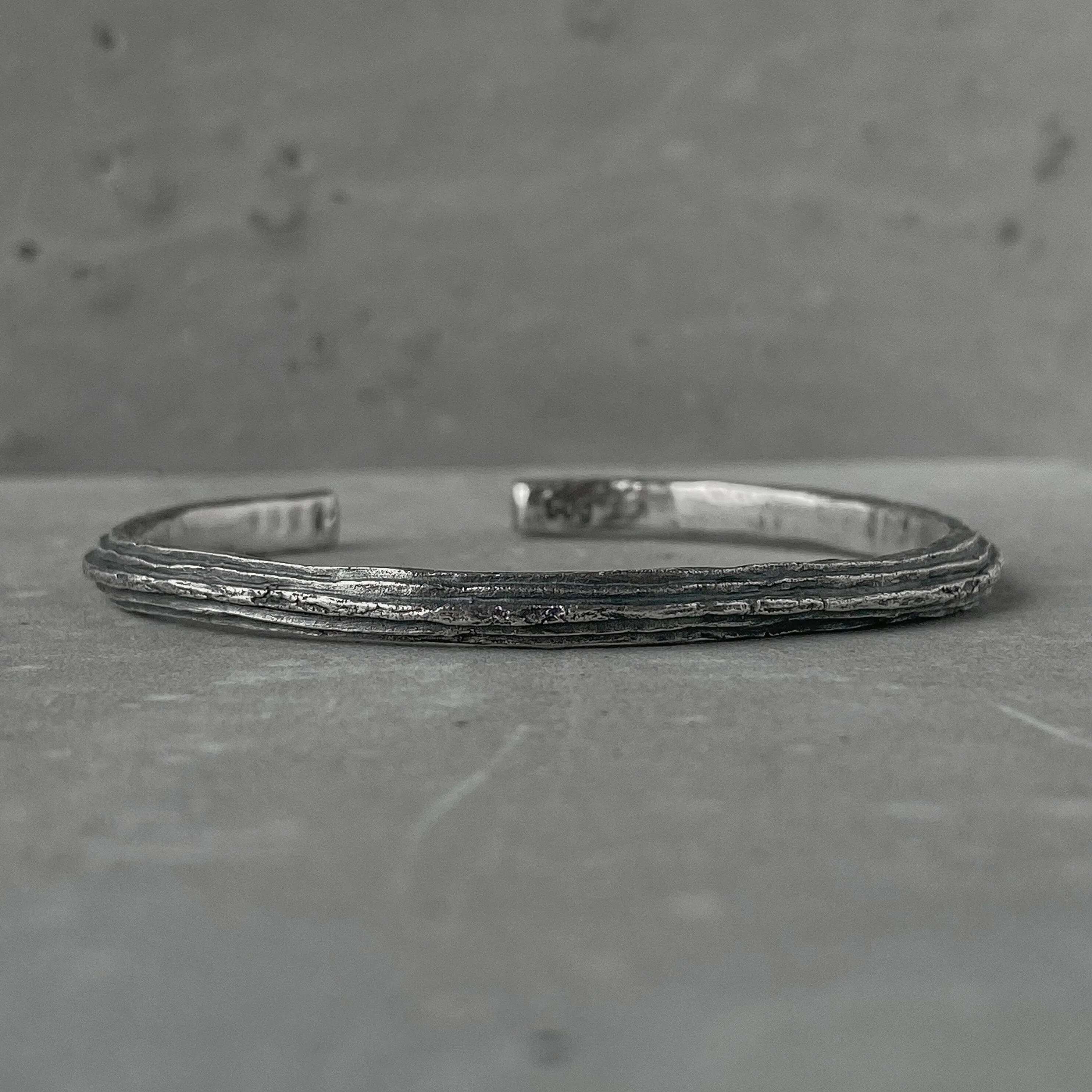 Orbit bangle- thin silver cuff bracelet with unusual hancrafted texture