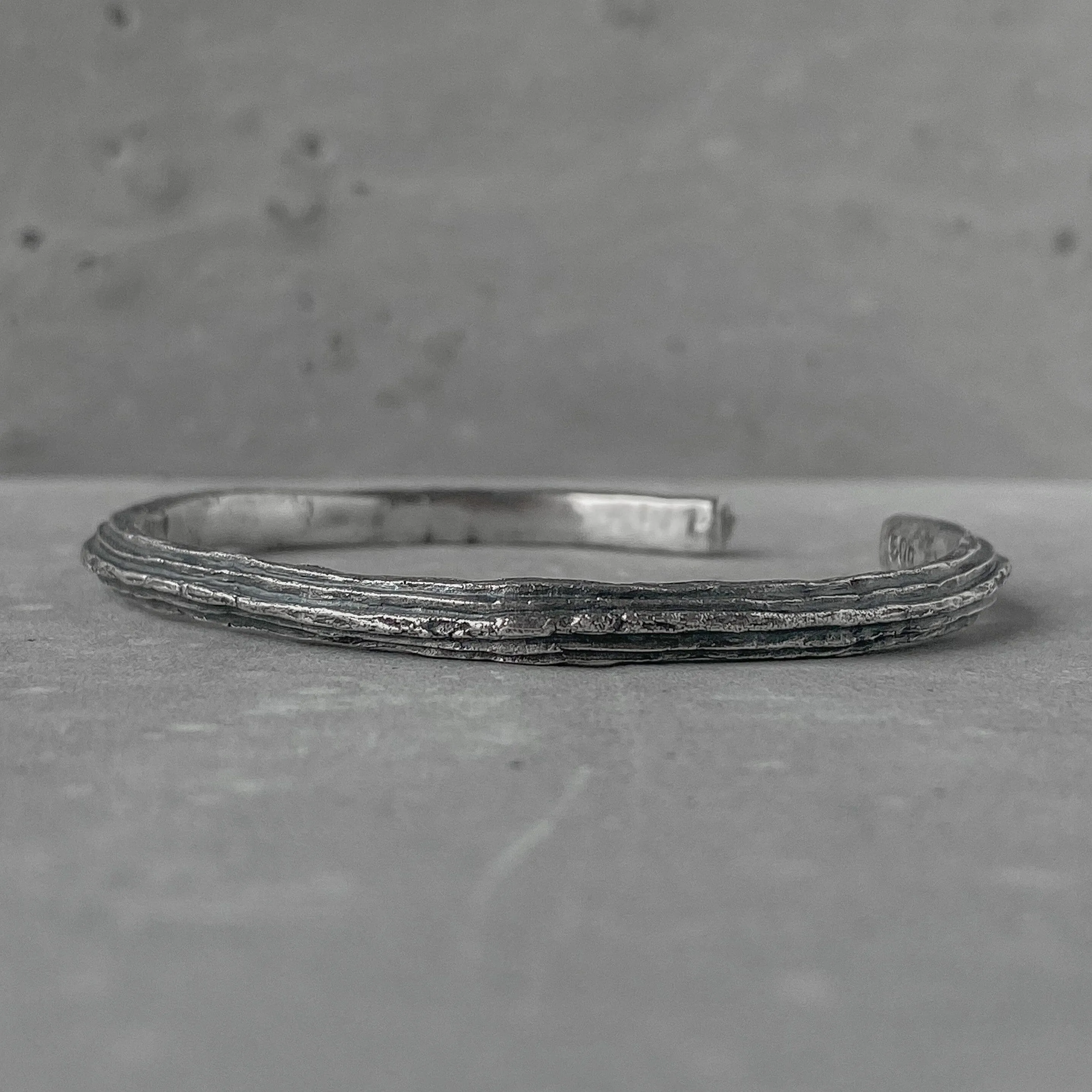 Orbit bangle- thin silver cuff bracelet with unusual hancrafted texture