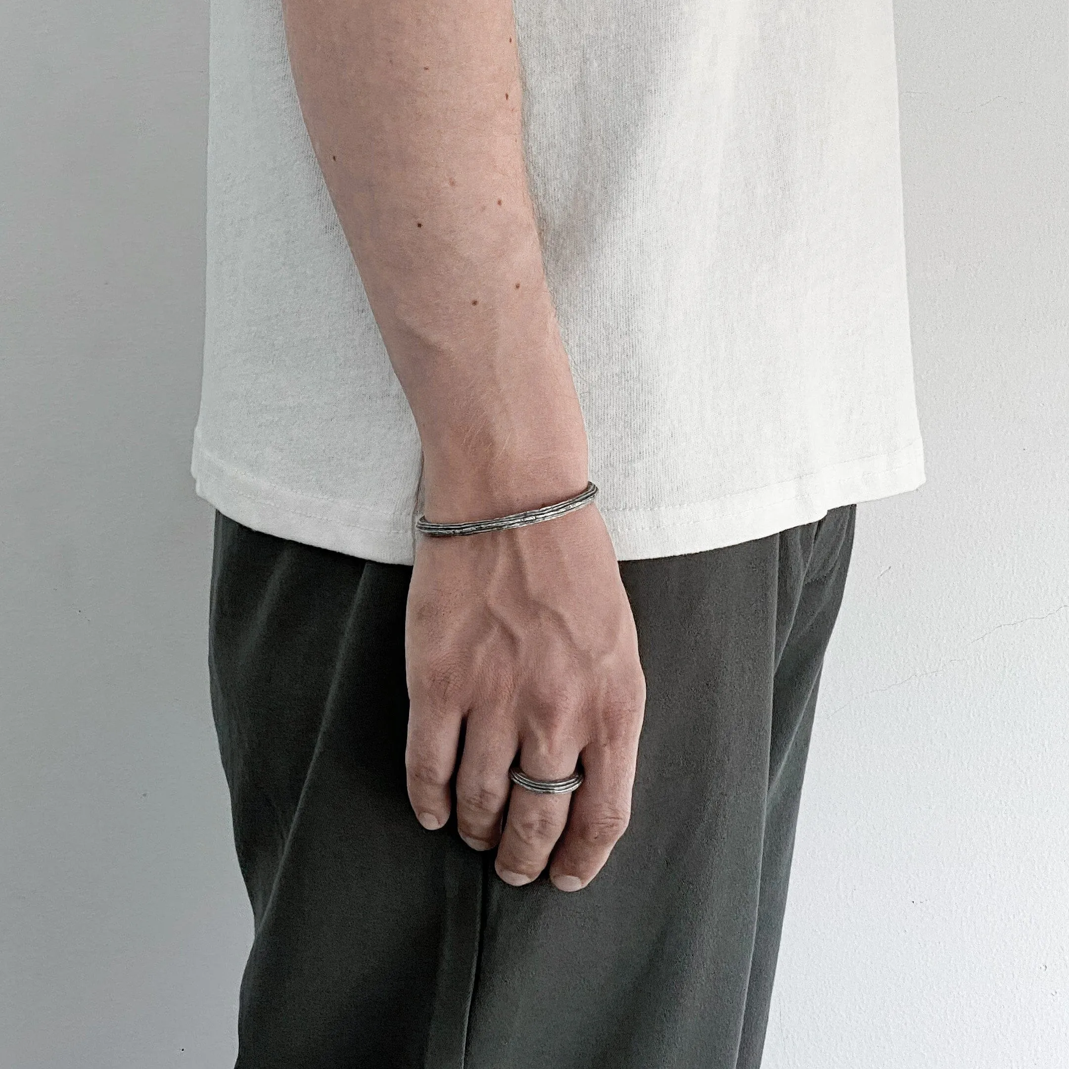 Orbit bangle- thin silver cuff bracelet with unusual hancrafted texture